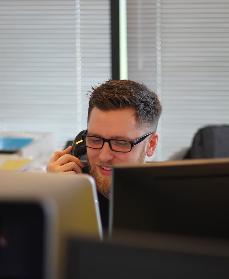 App Specialist on a support call at their desk
